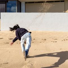 artwork by Drew Kahuʻāina Broderick, ““a handful of sand thrown against a white wall after work, amidst a rising tide”, 2020 included in UQ Art Museum exhibition: Mare Amoris | Sea of Love.   
