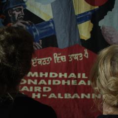 Image: Still from Workers!, showing walls decorated with posters, by Petra Bauer and SCOT PEP. 2018. (Courtesy the artists).