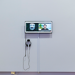 Part of the artwork showing a screen with artist Daniel McKewen in conversation with Anonymous
