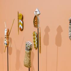 Bagu sculptures installed on a gallery wall