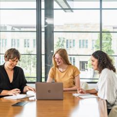 Three people having a meeting