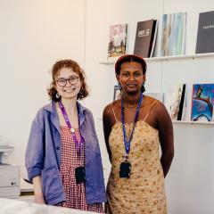 Two staff members smiling at the camera